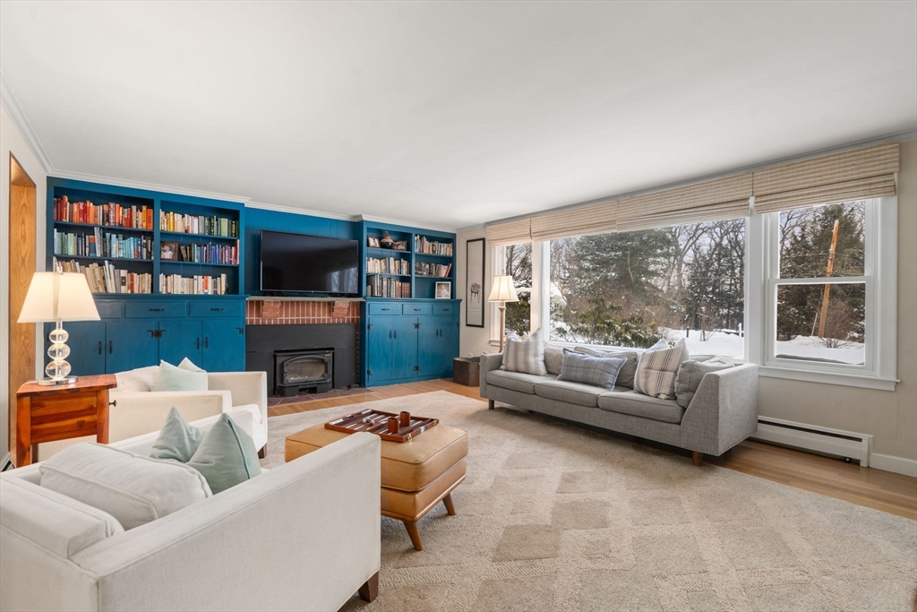 26 Jeffrey Road Wayland, MA 01778 - Photo 6 of 40 a living room with furniture and a fireplace