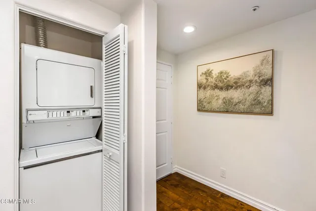 a view of a hallway with washer and dryer