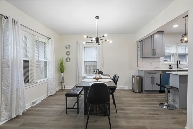 a view of a dining room with furniture window and wooden floor