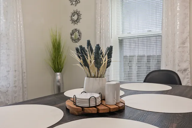 a view of a dining room with furniture wooden floor and a chandelier