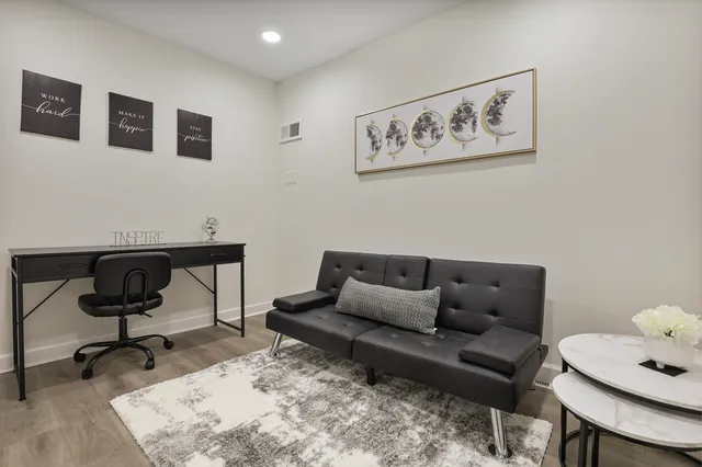 a living room with furniture and a rug