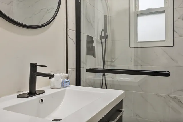 a bathroom with a sink and a mirror
