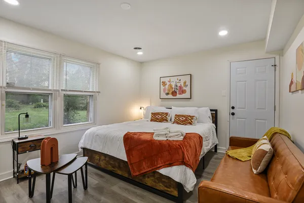 a bedroom with a bed and a window