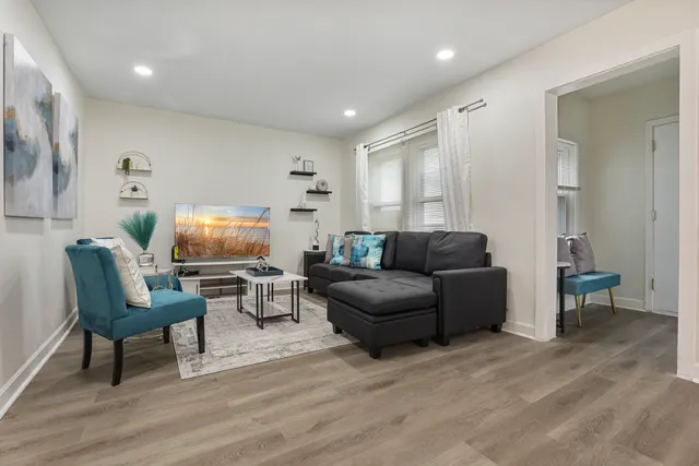 a living room with furniture and a flat screen tv