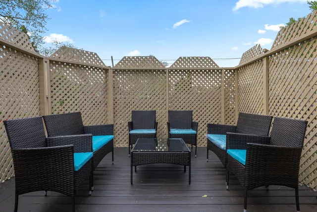 a view of a terrace with seating area and furniture