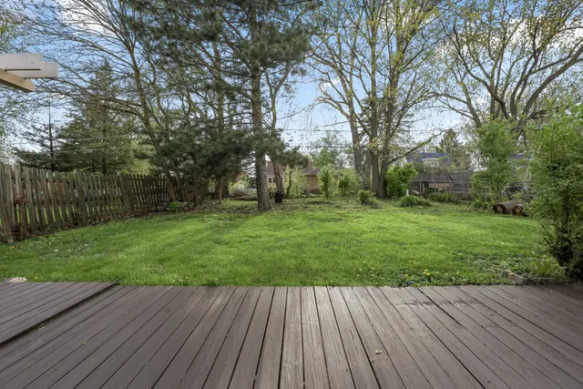 a view of a backyard with wooden floor
