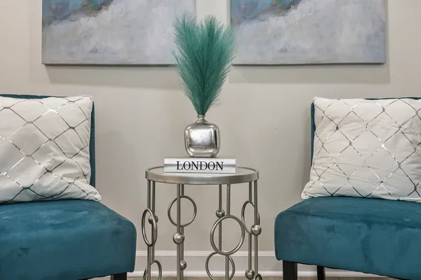 a living room with furniture and a potted plant