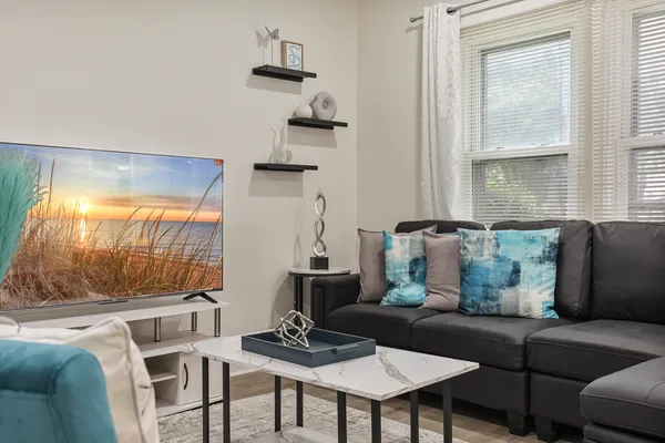 a living room with furniture and a large window