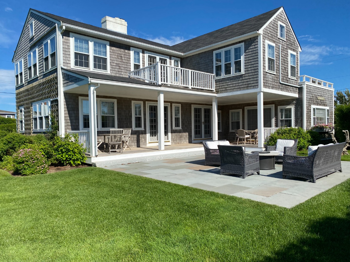 76 Baxter Road Nantucket, MA 02554 - Photo 3 of 25 a view of a house with a patio and a yard