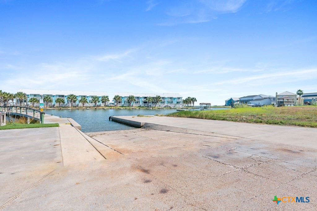 2292 North Fulton Beach Road, Unit 505 Rockport, TX 78382 - Photo 45 of 46 a view of a swimming pool and a yard