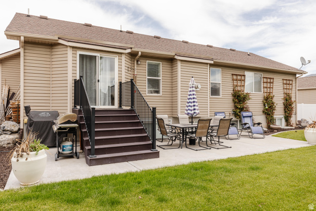 972 West 2840th Street South Logan, UT 84321 - Photo 37 of 46 Expansive concrete patio and manicured lawn