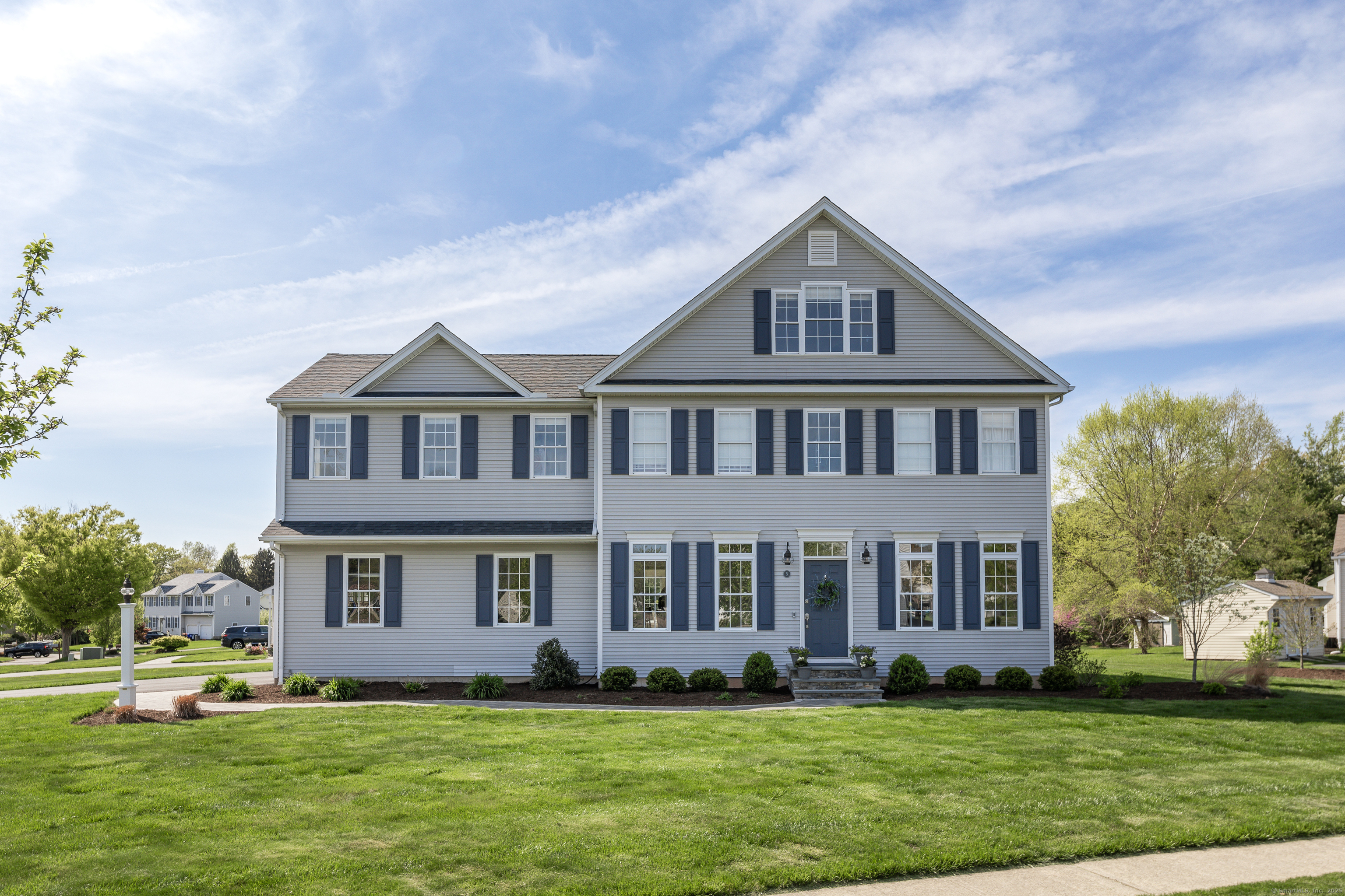 a front view of a house with a yard