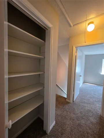 a bathroom with a granite countertop sink a mirror and a vanity