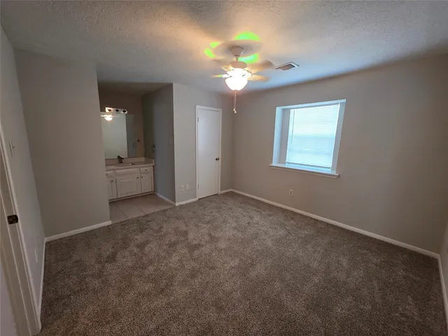 a bathroom with a granite countertop sink mirror and bathtub