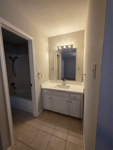a white toilet sitting next to a shower