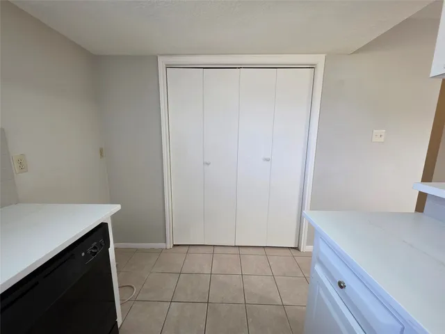 a room with a cabinets and a sink