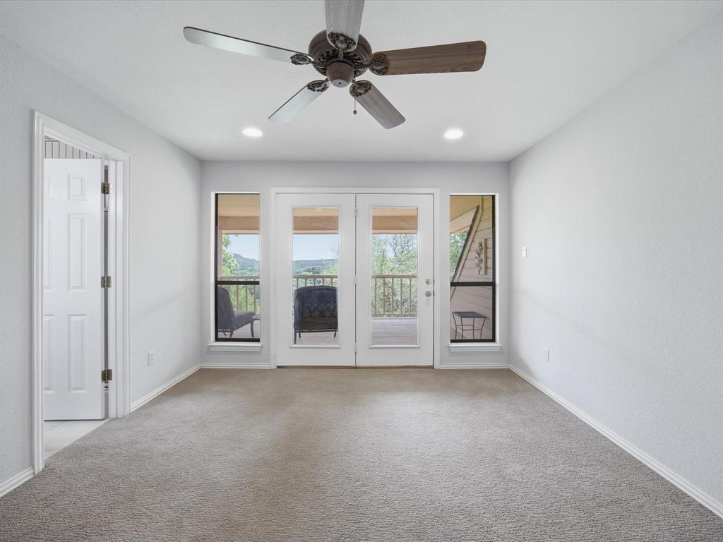 10106 Ravenswood Road Granbury, TX 76049 - Photo 19 of 39 a view of an empty room with a window