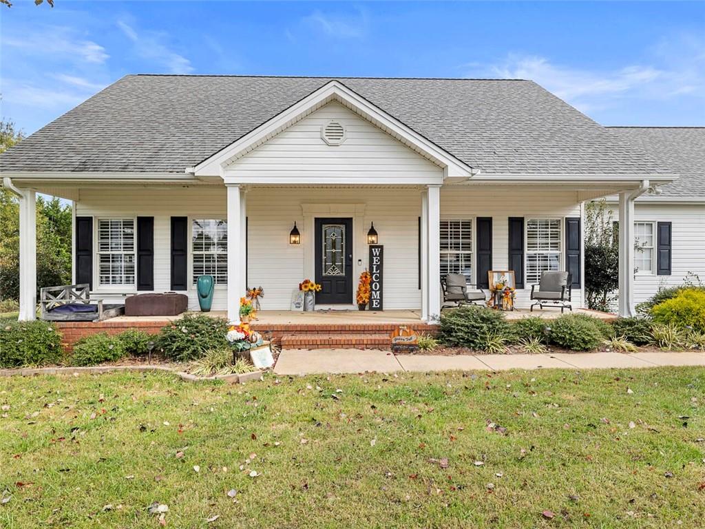 5508 Clarks Bridge Road Clermont, GA 30527 - Photo 1 of 1 a view of a house with backyard and porch