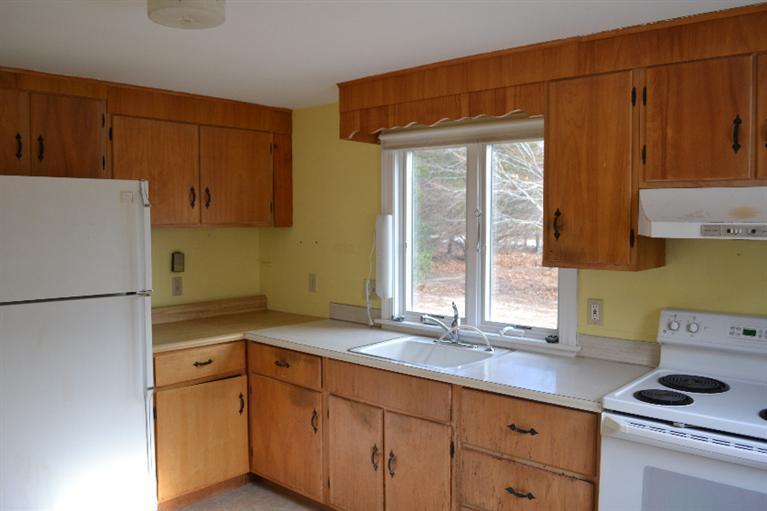 1755 Bridge Road Eastham, MA 02642 - Photo 6 of 10 a kitchen with a refrigerator and a sink