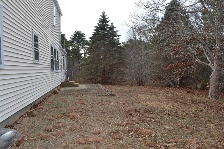 1755 Bridge Road Eastham, MA 02642 - Photo 9 of 10 a view of a backyard with large trees