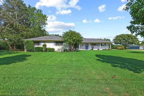 a house view with a garden space
