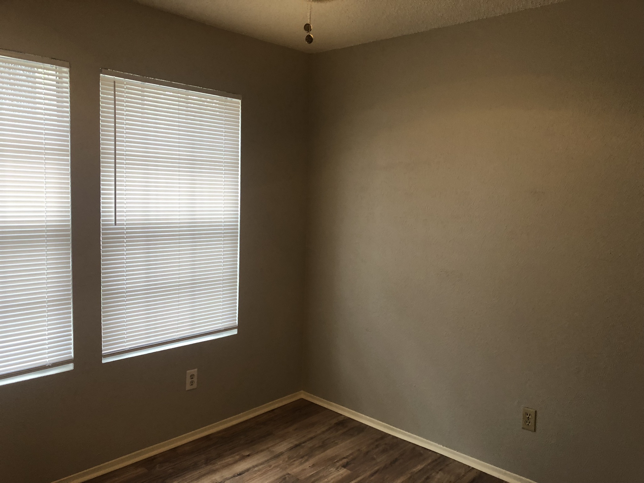 7002 Ivory Key Court, Unit B Austin, TX 78745 - Photo 9 of 10 Spare room with baseboards and dark wood finished floors