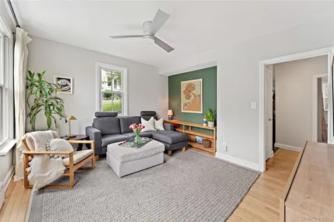 a living room with furniture and a window