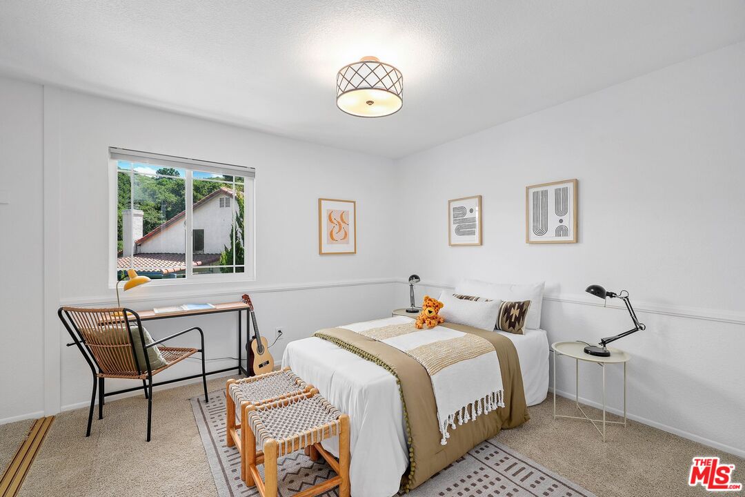 24006 Briardale Way Newhall, CA 91321 - Photo 19 of 34 a bedroom with a bed and a window