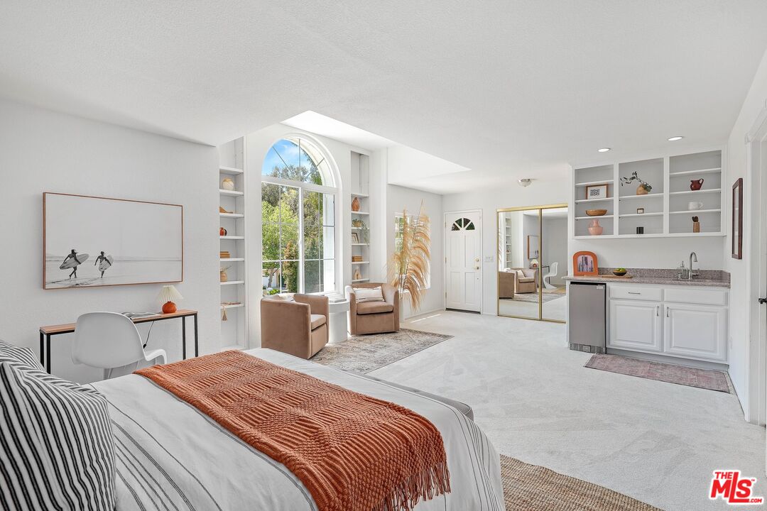 24006 Briardale Way Newhall, CA 91321 - Photo 21 of 34 a bedroom with a large bed and a large window