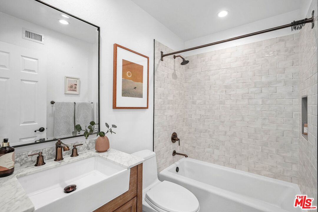 24006 Briardale Way Newhall, CA 91321 - Photo 22 of 34 a bathroom with a sink toilet and shower