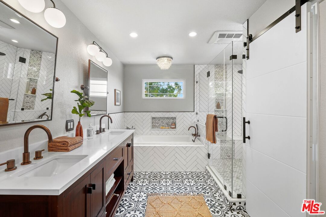 24006 Briardale Way Newhall, CA 91321 - Photo 25 of 34 a bathroom with a tub sink and mirror