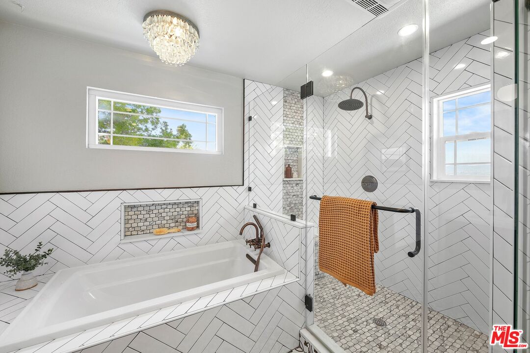 24006 Briardale Way Newhall, CA 91321 - Photo 26 of 34 a bathroom with a bathtub and a shower