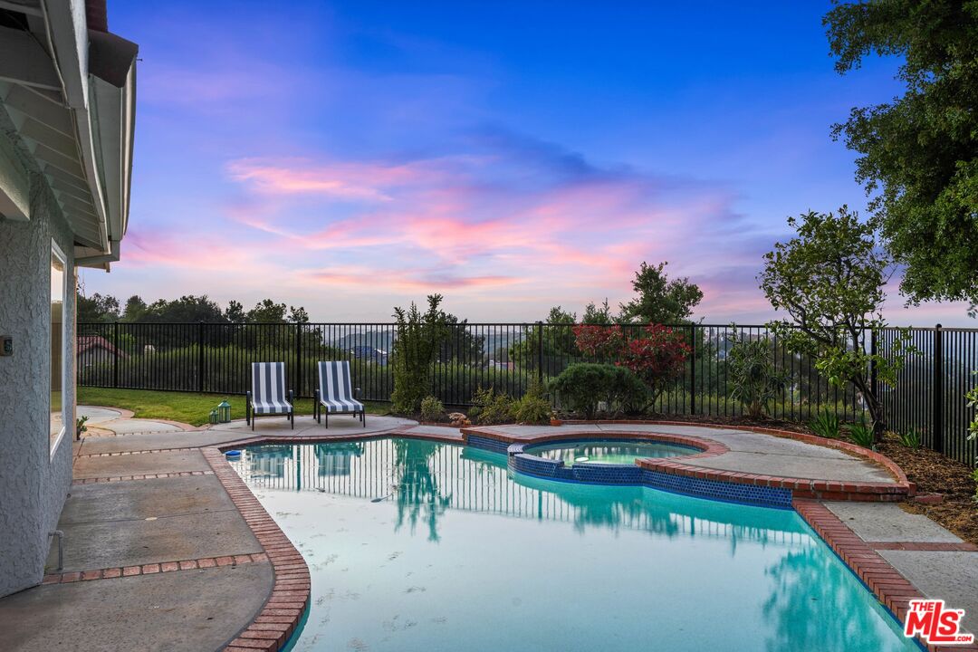 24006 Briardale Way Newhall, CA 91321 - Photo 30 of 34 a view of swimming pool with a yard