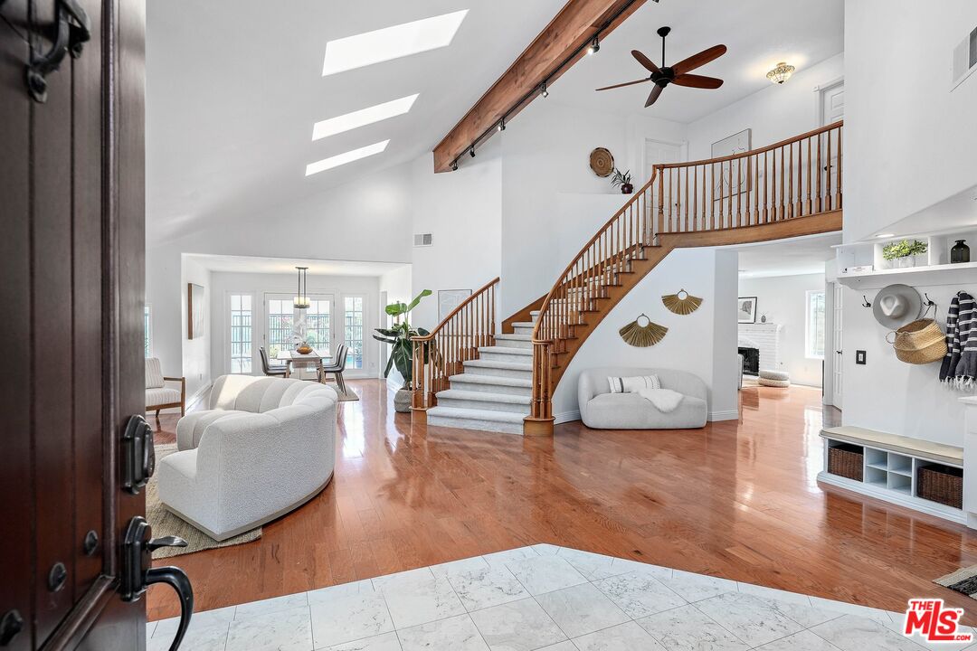 24006 Briardale Way Newhall, CA 91321 - Photo 3 of 34 a living room with furniture and wooden floor