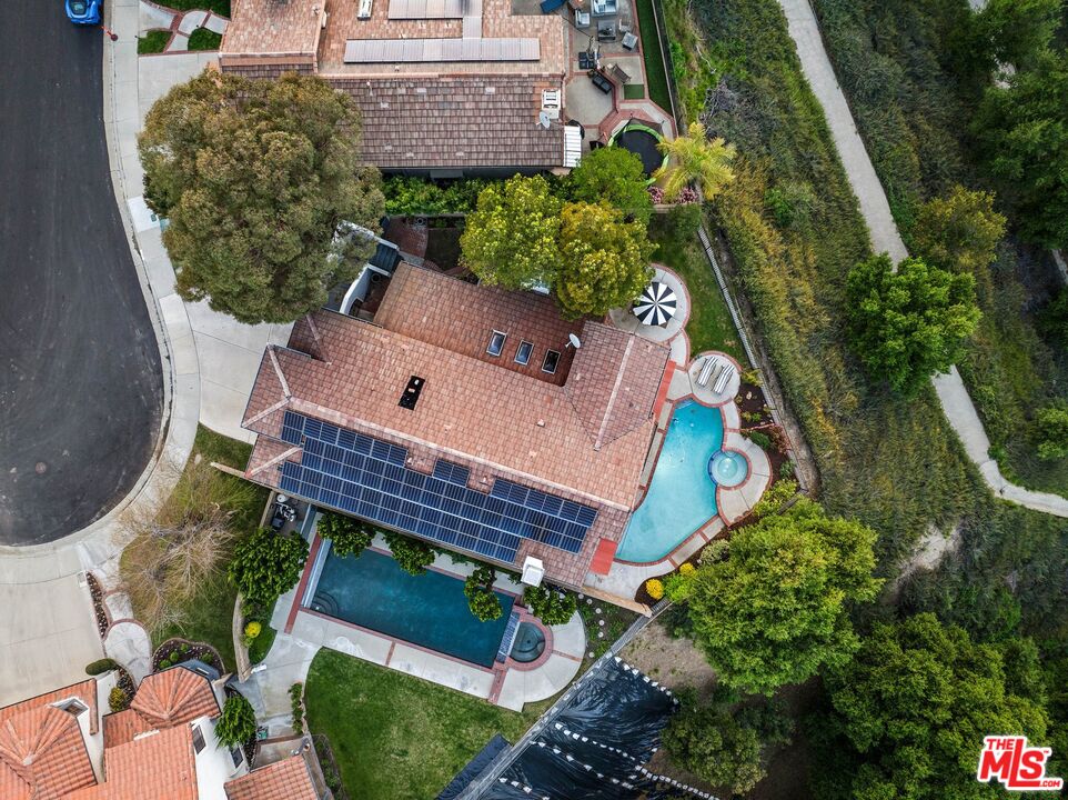 24006 Briardale Way Newhall, CA 91321 - Photo 32 of 34 an aerial view of a house with a yard and potted plants