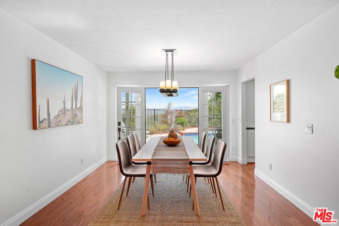 24006 Briardale Way Newhall, CA 91321 - Photo 6 of 34 a dining room with furniture window and wooden floor