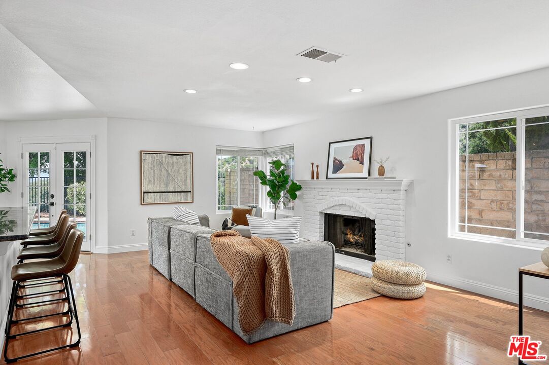 24006 Briardale Way Newhall, CA 91321 - Photo 8 of 34 a living room with furniture fireplace and window