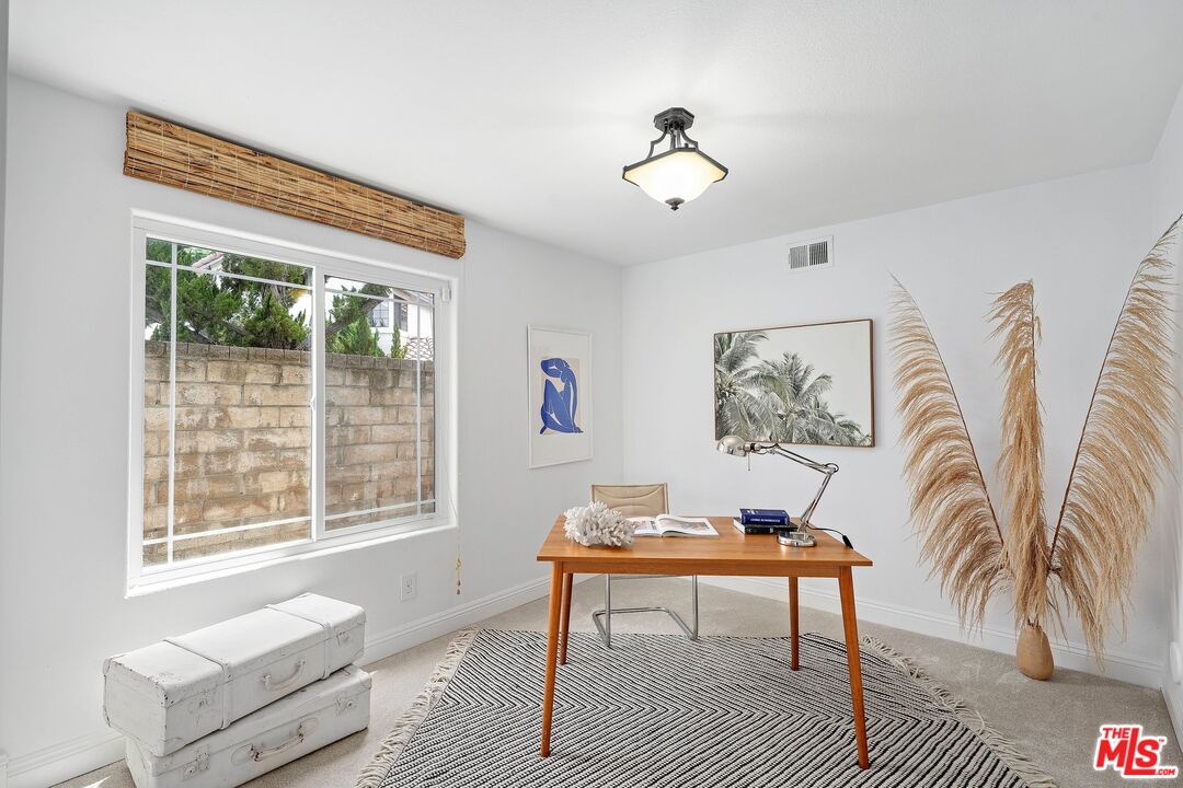 24006 Briardale Way Newhall, CA 91321 - Photo 10 of 34 a view of a livingroom with furniture and window
