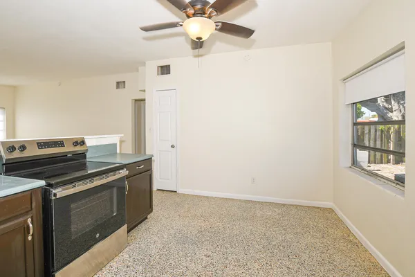a kitchen with a stove and a microwave