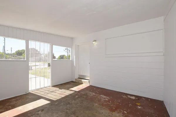 a view of an empty room and window