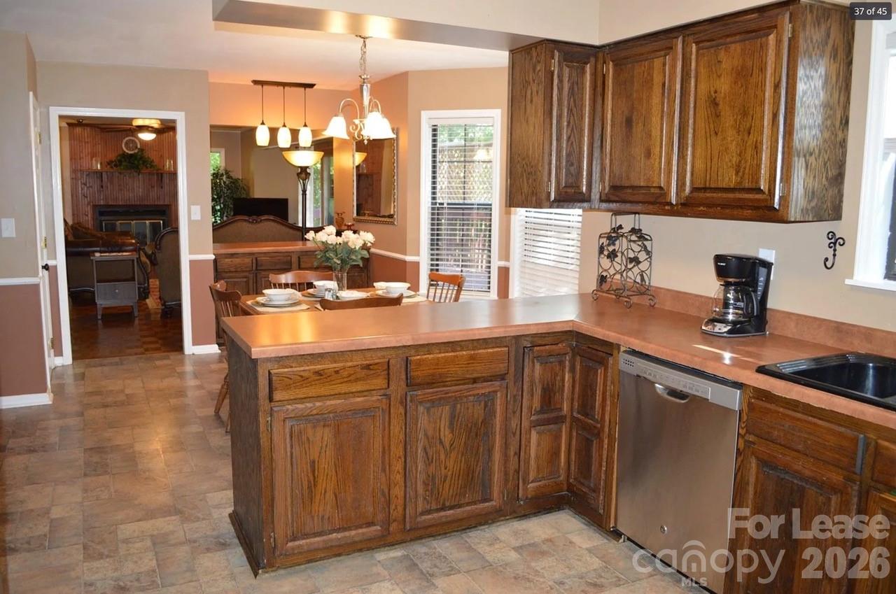 4167 Greenview Court Fort Mill, SC 29708 - Photo 5 of 16 a kitchen with stainless steel appliances granite countertop a sink and cabinets