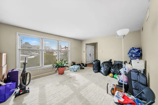 a living room with furniture and gym equipment