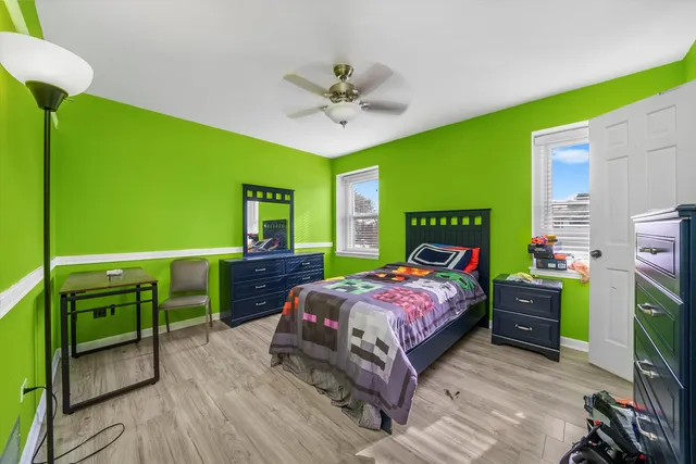 a bedroom with a bed and a table