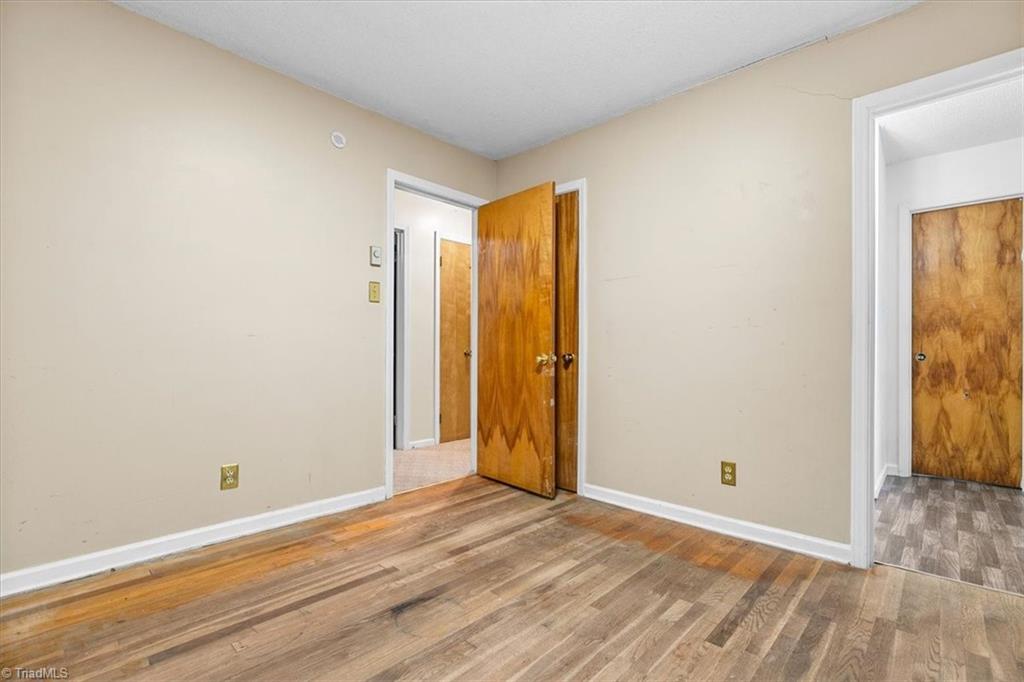 5822 Ruralview Road Gibsonville, NC 27249 - Photo 17 of 35 Bedroom 1 with fresh paint and wood flooring