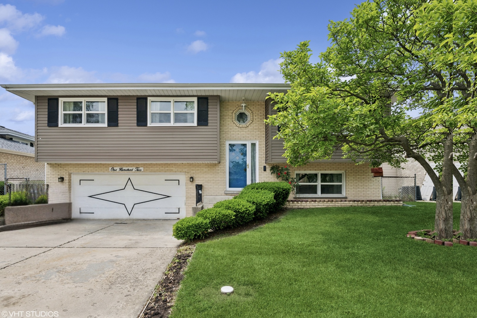 a house view with a garden space