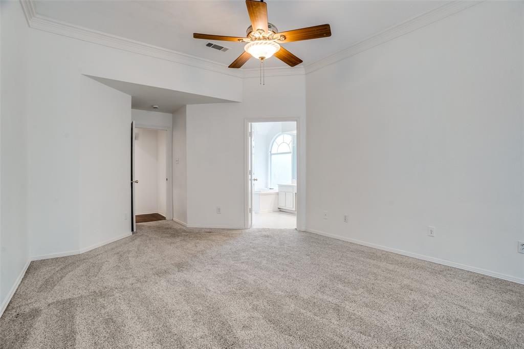 901 Autumn Ridge Drive McKinney, TX 75072 - Photo 14 of 24 an empty room with closet and a chandelier fan