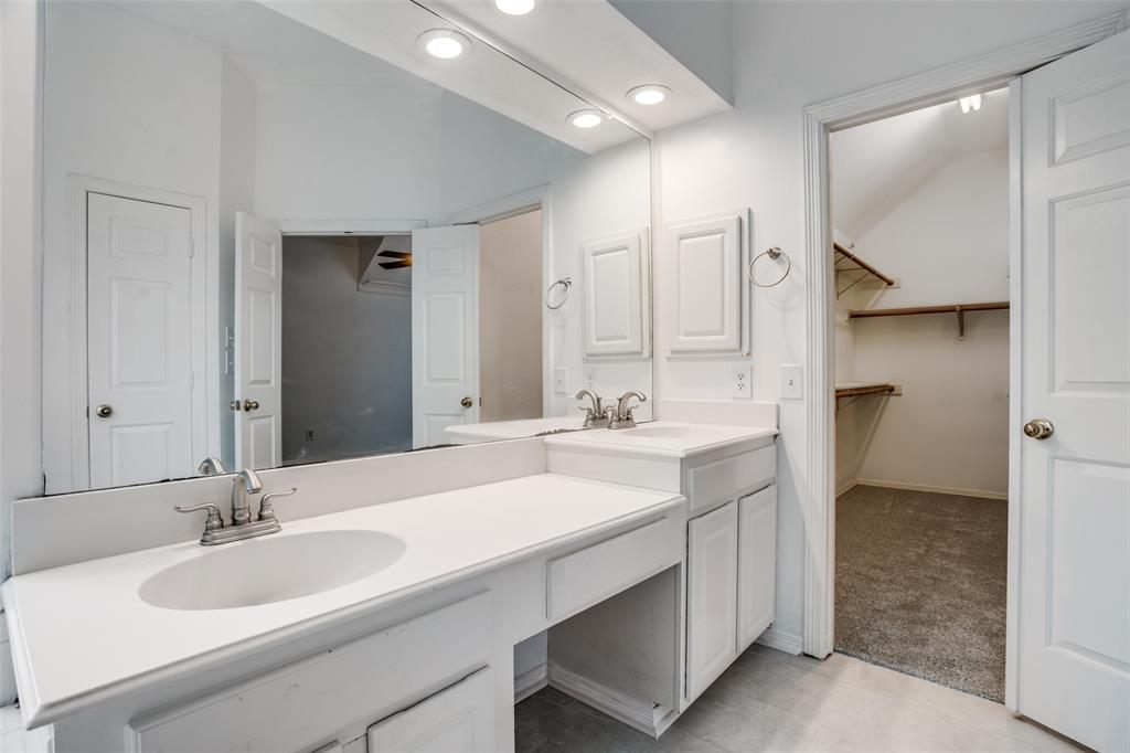 901 Autumn Ridge Drive McKinney, TX 75072 - Photo 16 of 24 a bathroom with a sink double vanity and a mirror