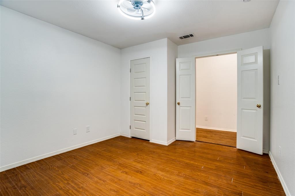 901 Autumn Ridge Drive McKinney, TX 75072 - Photo 18 of 24 an empty room with wooden floor and windows