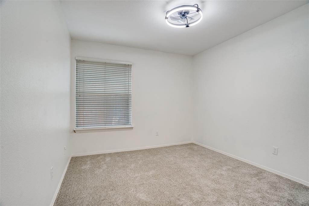 901 Autumn Ridge Drive McKinney, TX 75072 - Photo 19 of 24 an empty room with a window