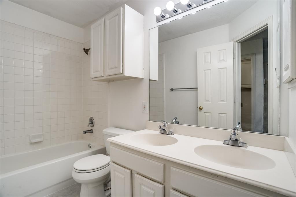 901 Autumn Ridge Drive McKinney, TX 75072 - Photo 21 of 24 a bathroom with a sink and a mirror